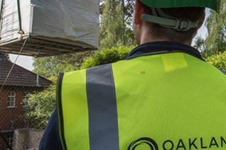 Oakland team member wearing Oakland branded hi-vis vest